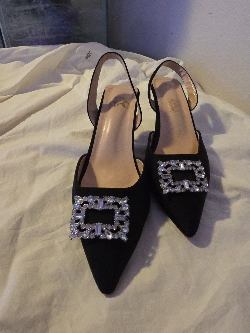 10.Deep Black Pointed Slingback Mules with Crystal Buckle